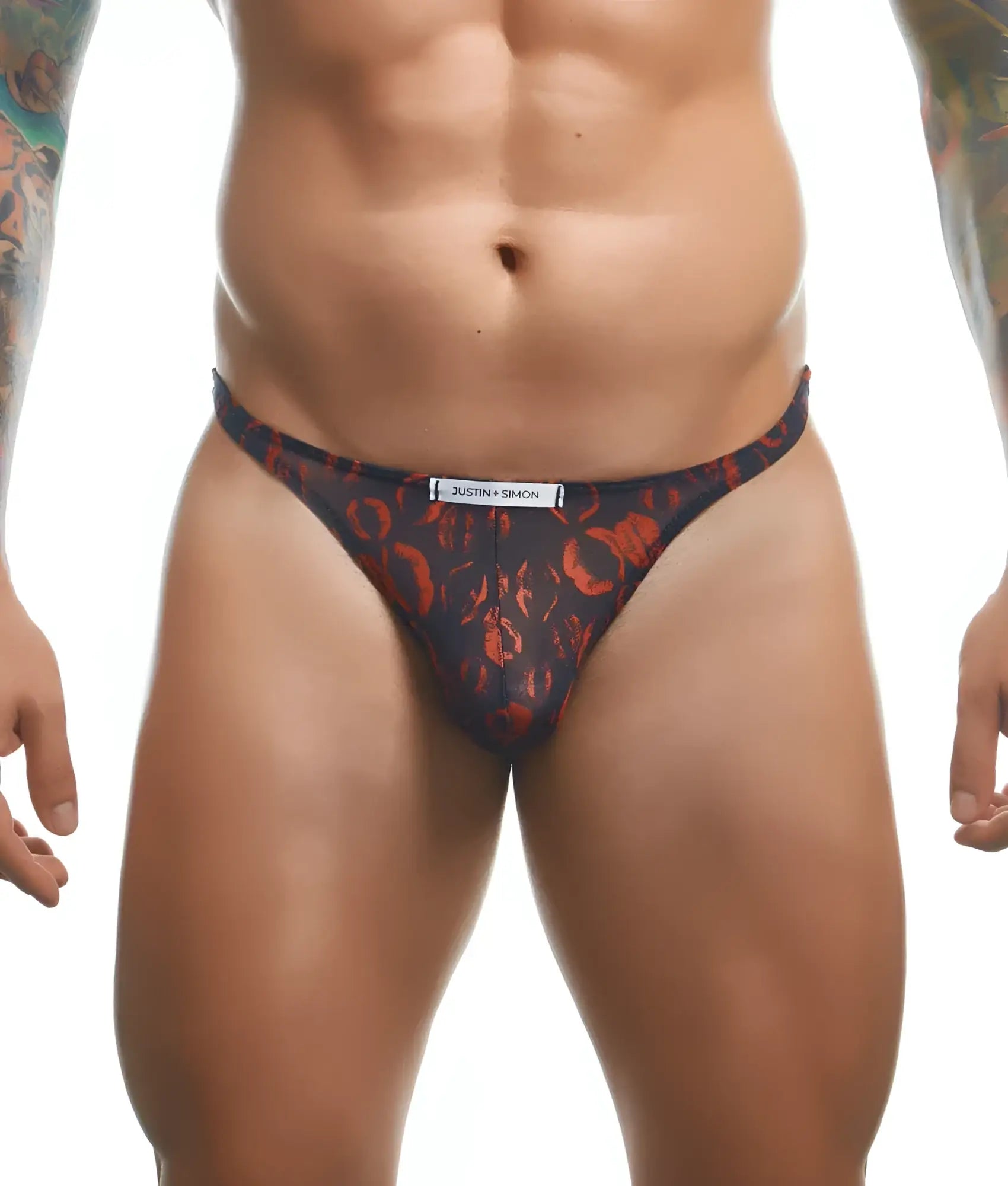 Dark blue thong with bold orange abstract pattern and justin simon brand label on the waistband front view