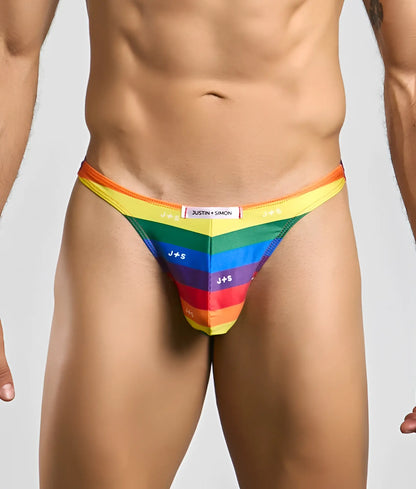 Rainbow-striped men’s thong by Justin and Simon with bold vibrant colors and sleek form-fitting design front view