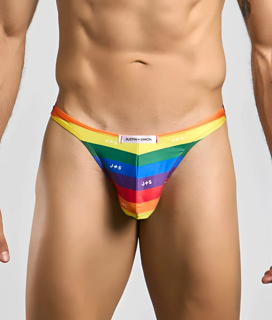 Rainbow-striped men’s thong by Justin and Simon with bold vibrant colors and sleek form-fitting design front view