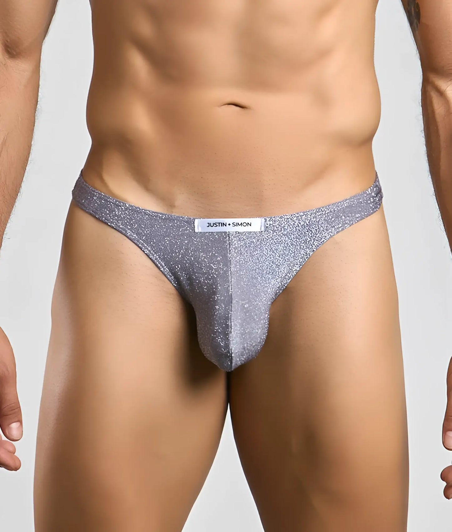 Silver glittery classic tanga thong from justin simon showcasing its sparkling fabric and sleek design