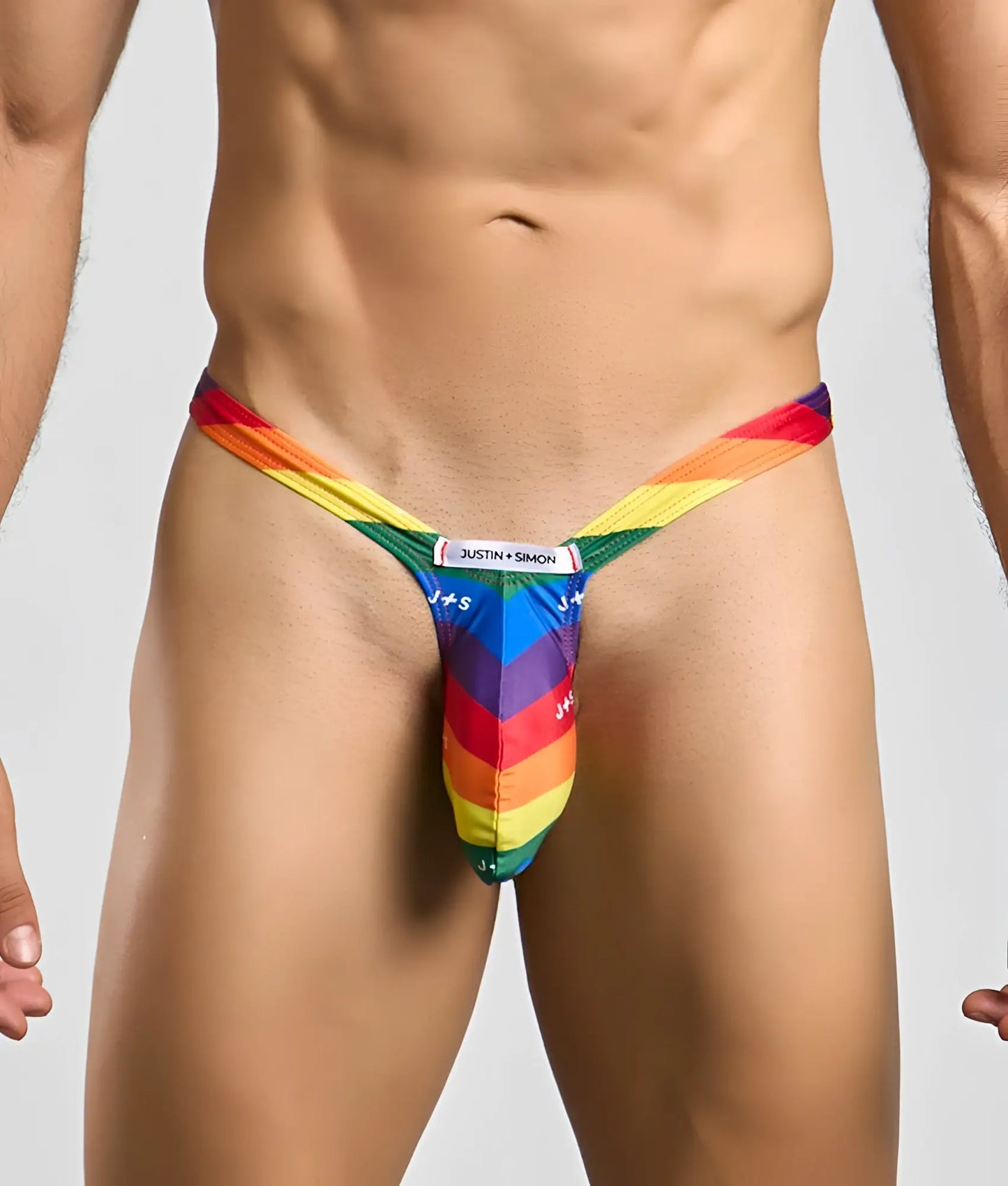 Rainbow-striped bulge thong by justin + simon made of soft stretch fabric for comfortable wear