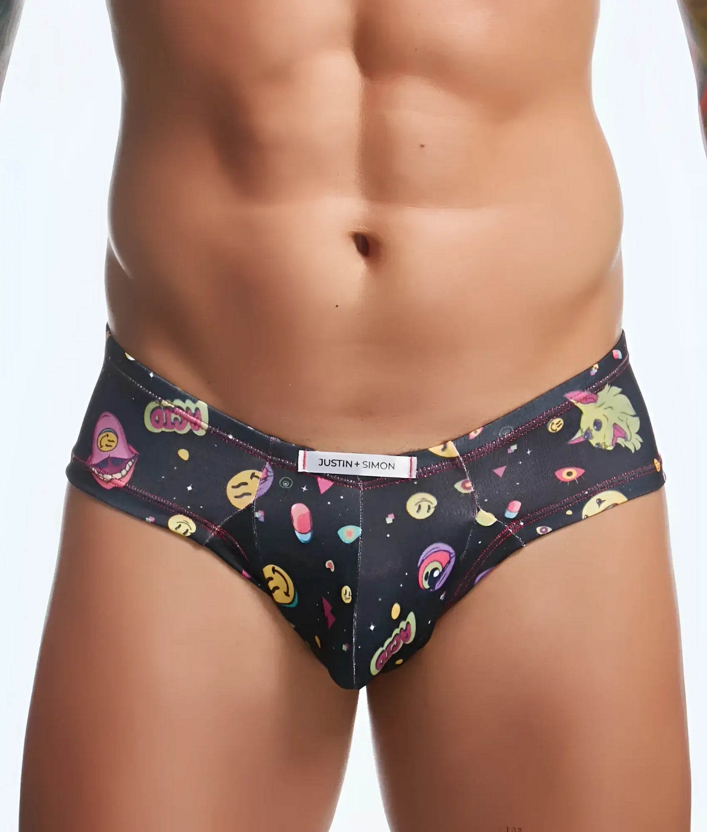 Black Justin + Simon briefs featuring a vibrant space-themed pattern with colorful emojis and cosmic elements.