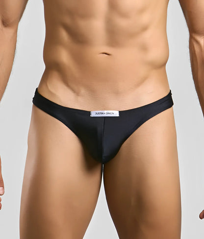 Black justin simon classic mens bikini briefs with sleek form-fitting design and subtle brand tag at the waistband
