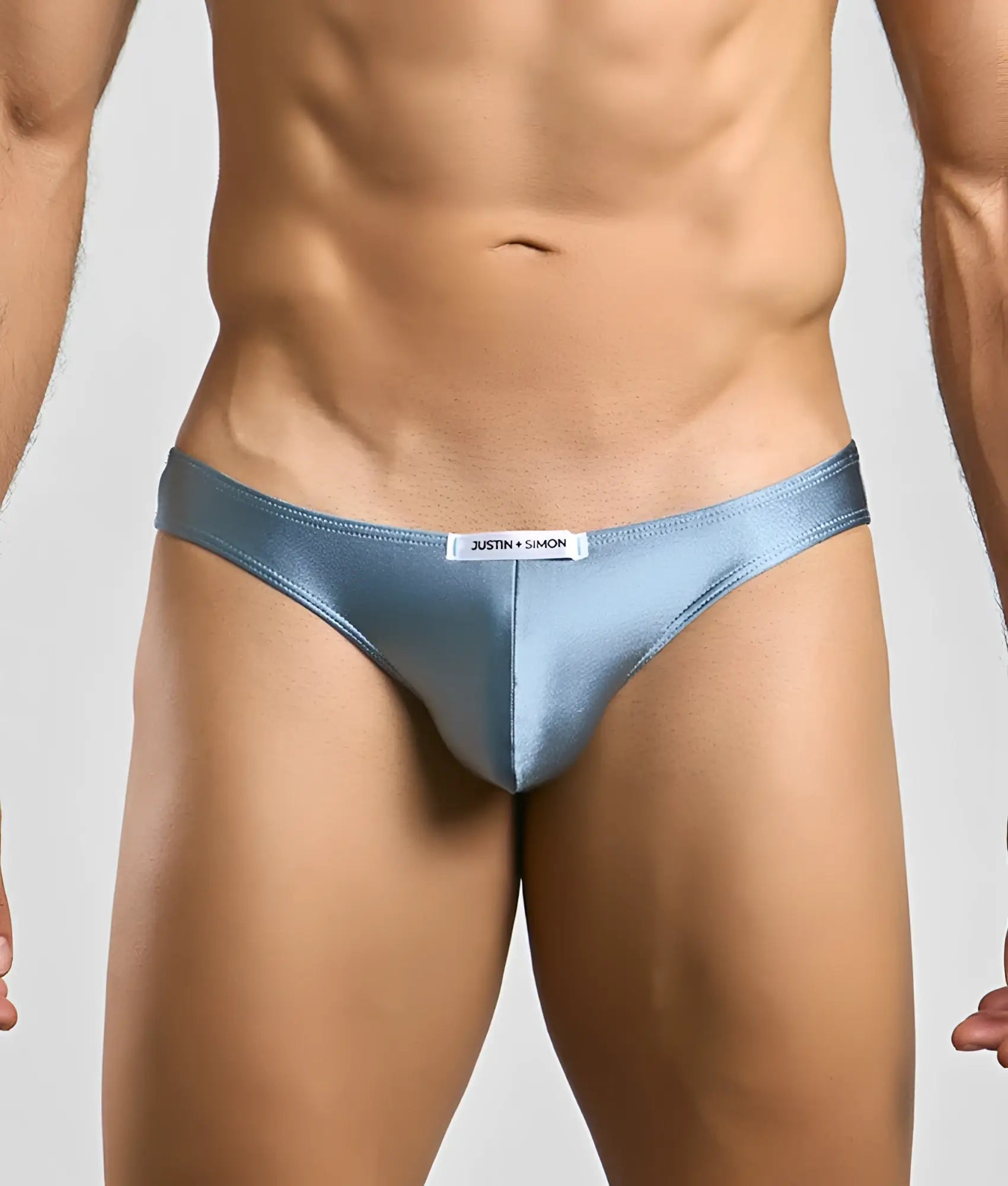 Light blue satin justin simon classic mens bikini briefs with sleek form-fitting design and white waistband brand tag