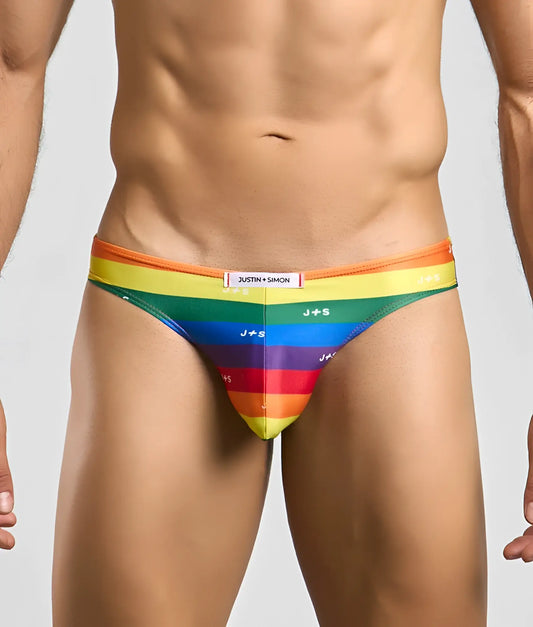 Justin plus simon classic mens bikini briefs with vibrant orange to purple rainbow stripes and repeating j plus s logos