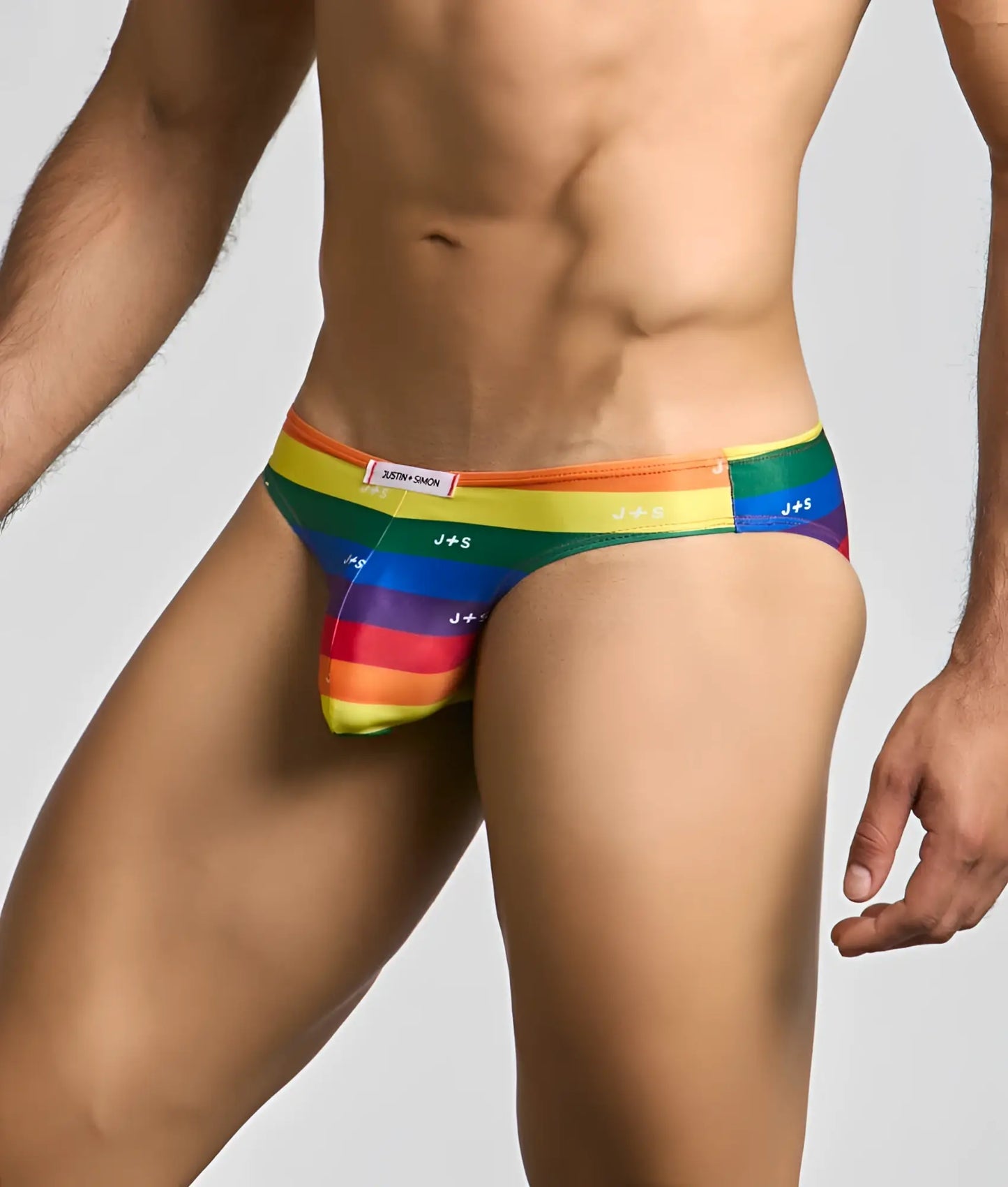 Rainbow-striped justin simon classic mens bikini briefs with j+s branding and snug form-fitting design