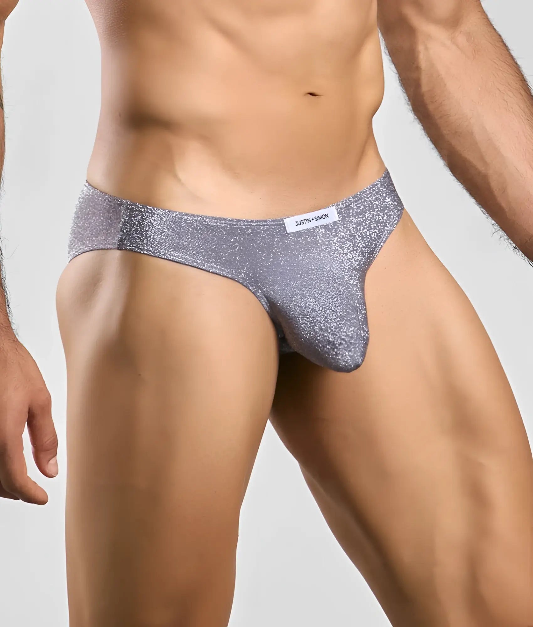 Silver glittery briefs with a snug form-fitting design from Justin Simon classic mens bikini collection
