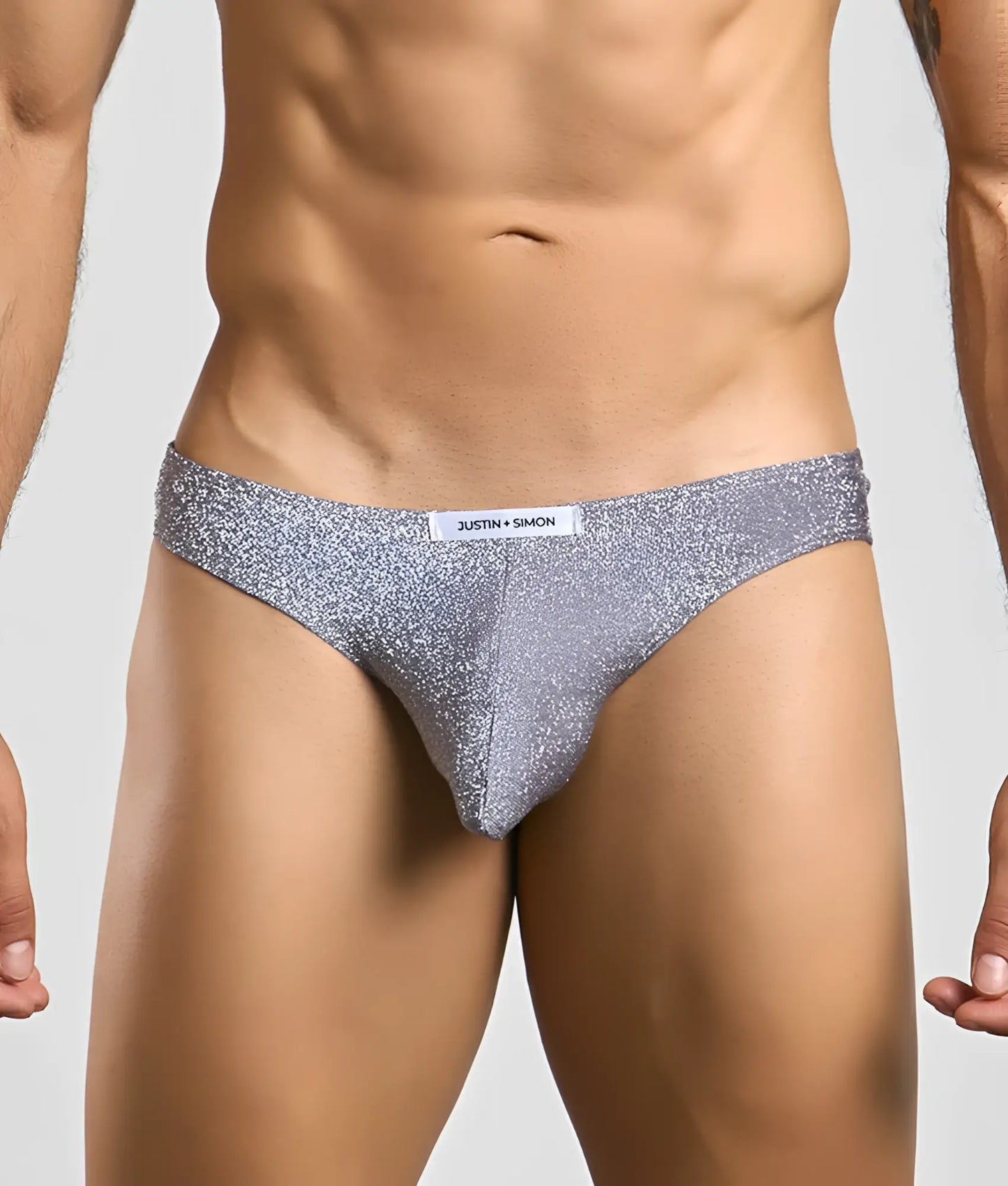 Silver glittery briefs with white justin + simon label on waistband classic mens bikini style