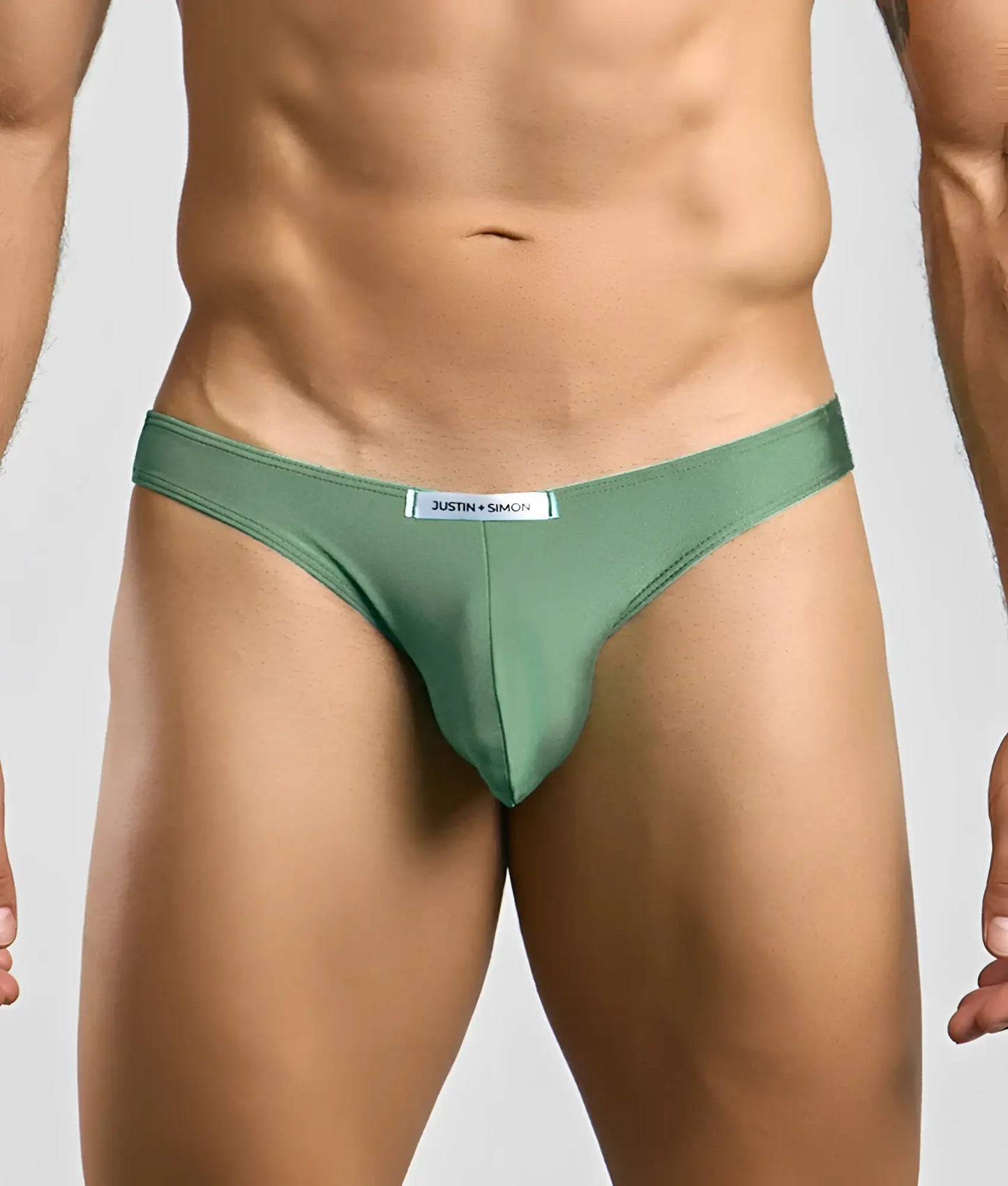 Justin + Simon classic mens bikini thong in olive green smooth fabric with subtle sheen and branded waistband label