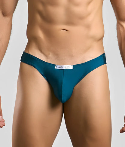 Teal classic mens bikini briefs by Justin + Simon with sleek smooth fabric and white label at the waistband