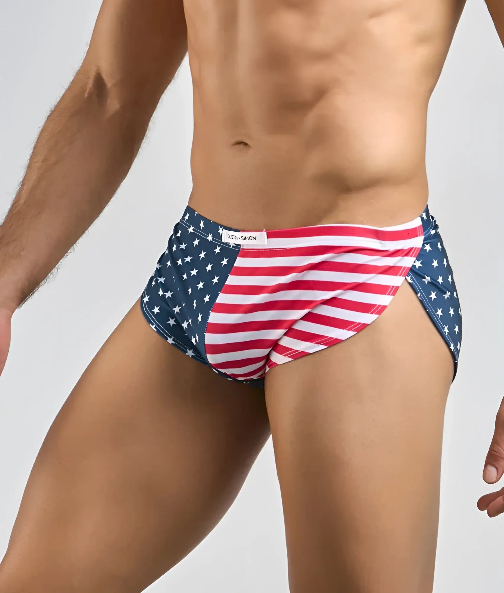 Justin + Simon running short men’s swim trunks in red white and blue with star-spangled American flag design