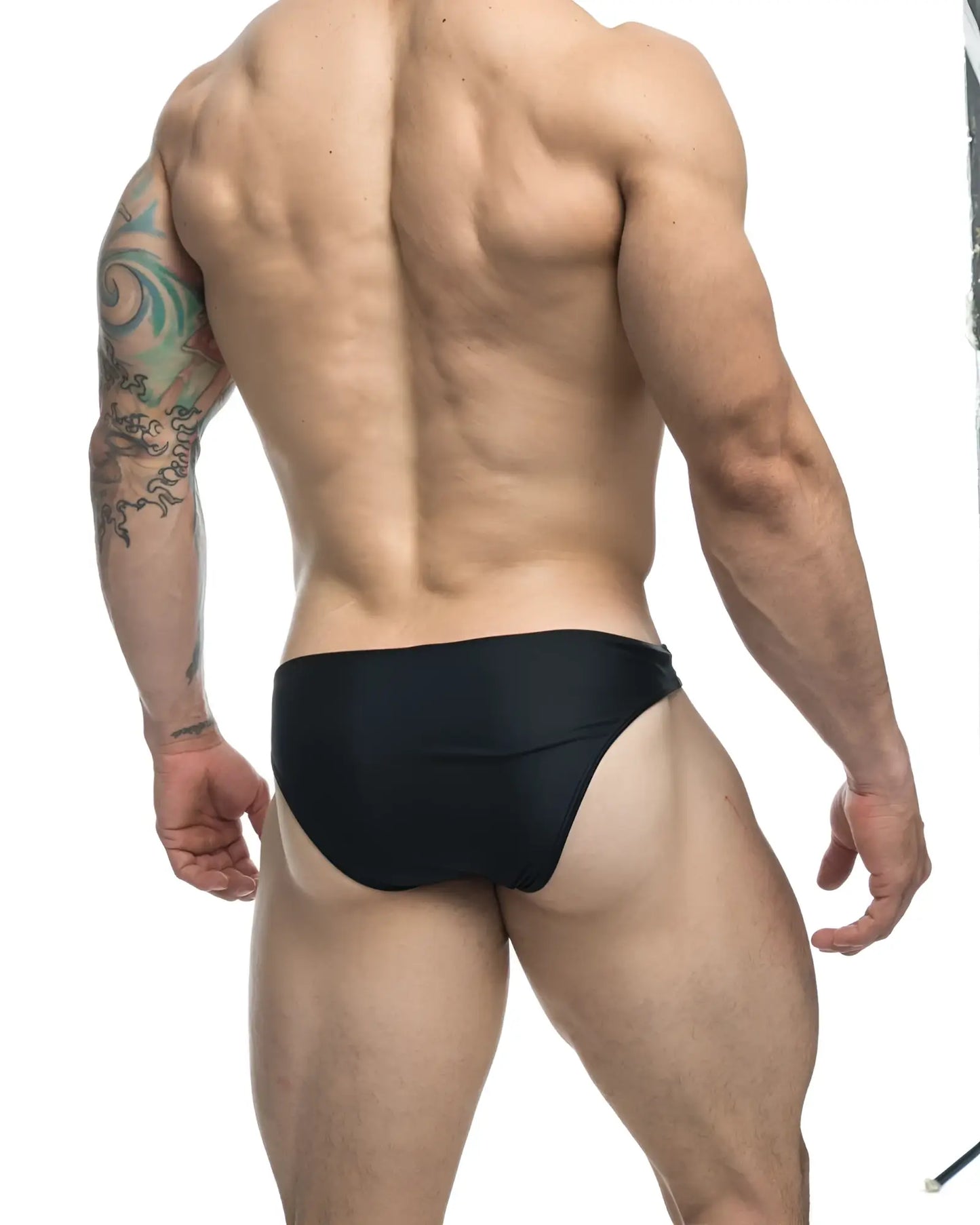 Black form-fitting swim trunks justin simon xsj01 classic bikini designed for comfortable swimwear use