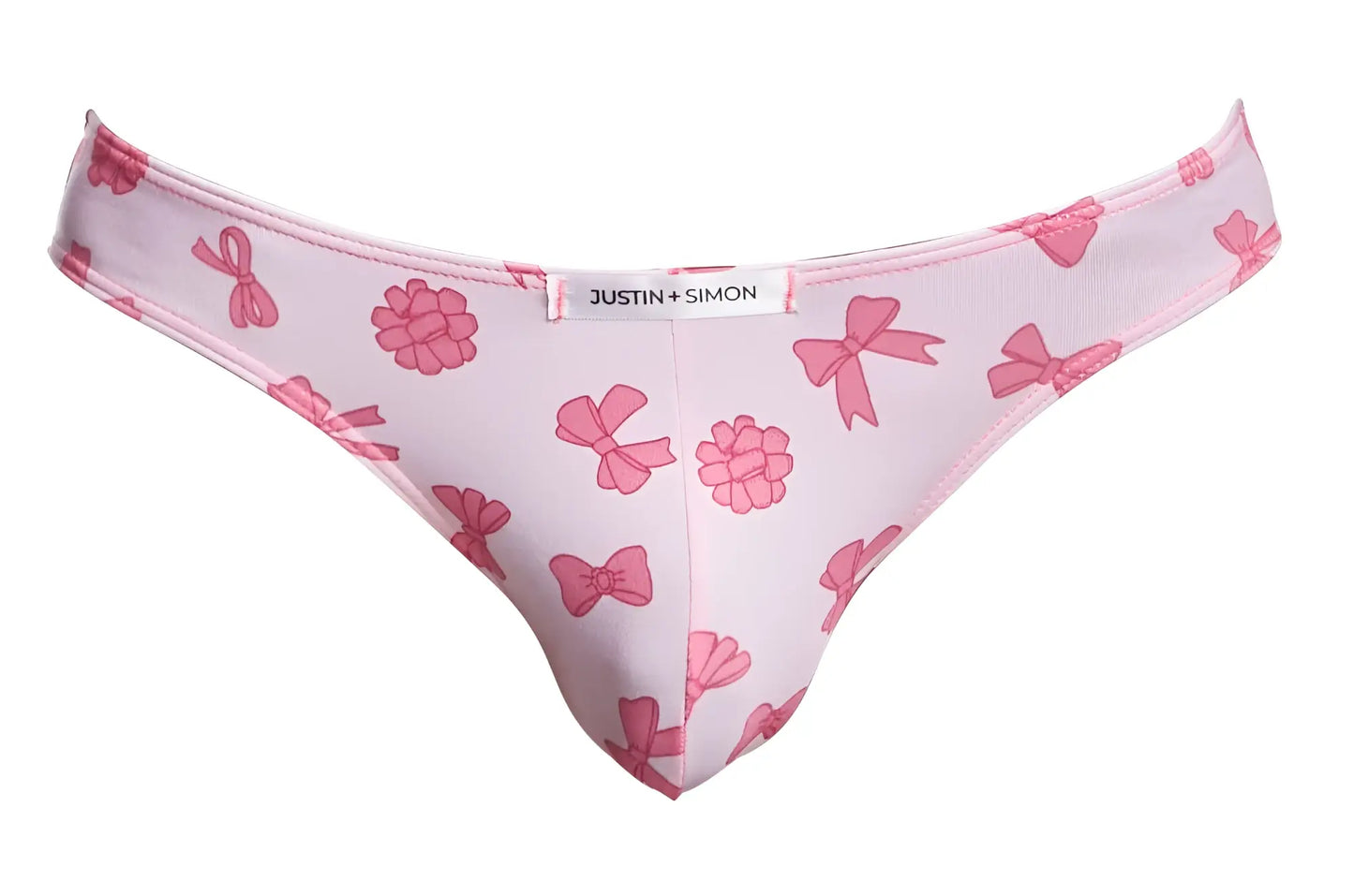 Pink patterned thong with raspberry designs and bow featuring a white justin plus simon label classic bikini style
