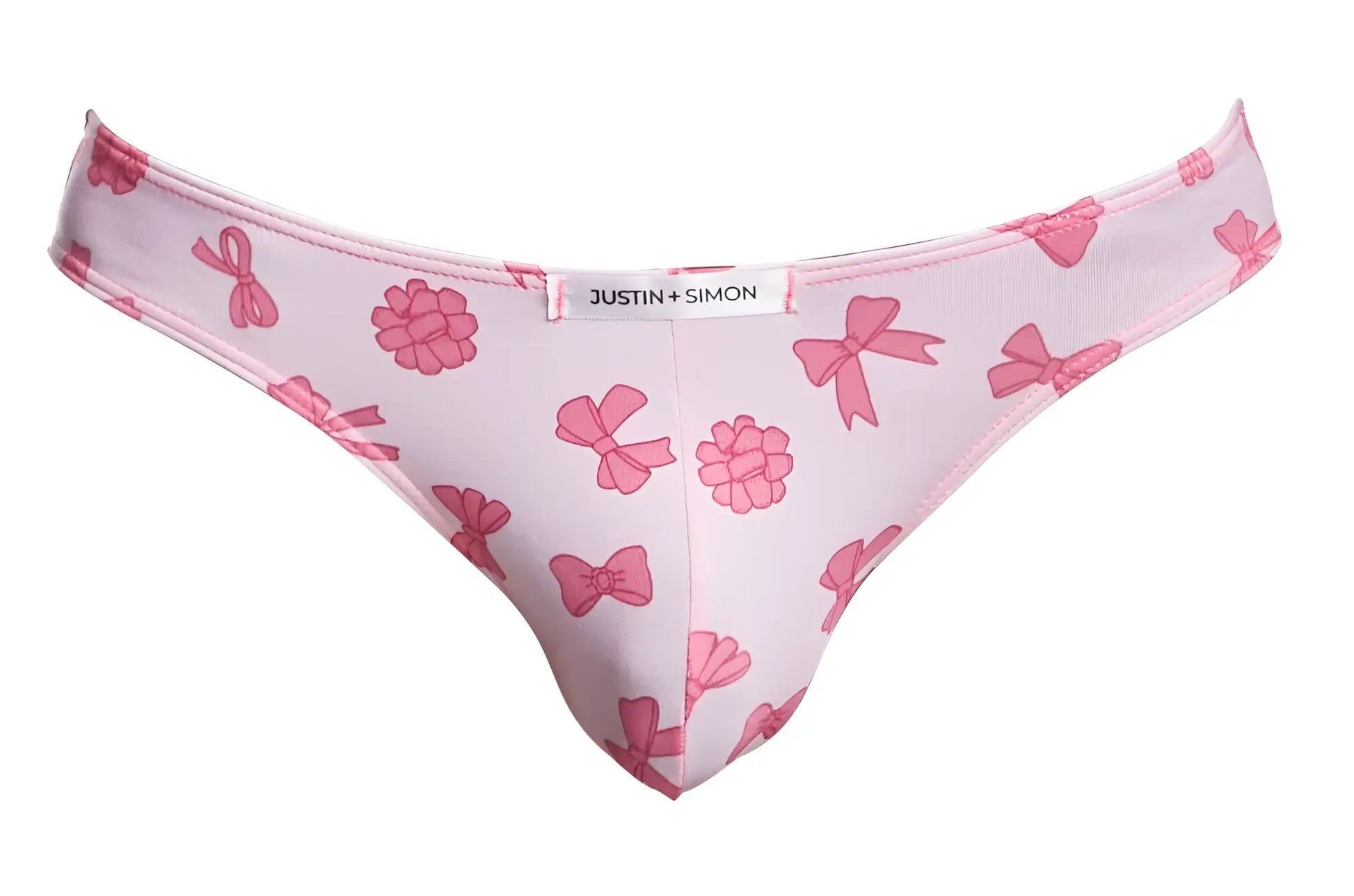 Pink patterned thong with raspberry designs and bow featuring a white justin plus simon label classic bikini style