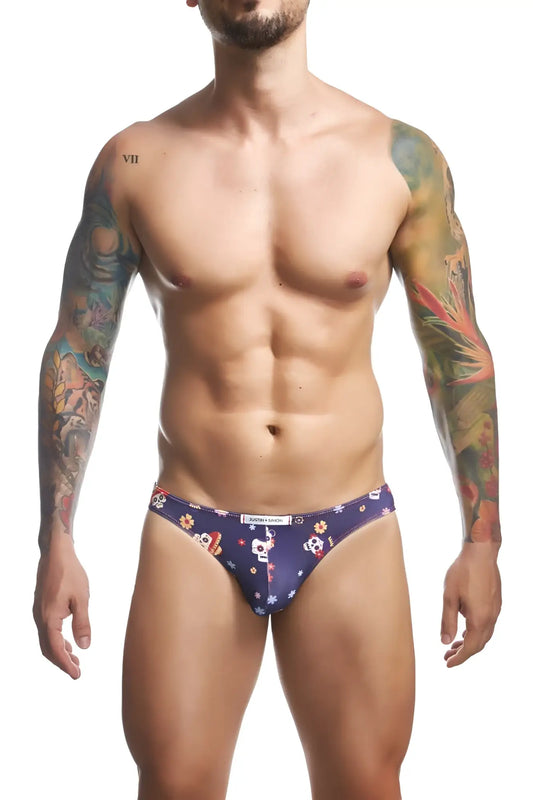 Dark blue men’s classic bikini briefs by justin simon xsj01 with white skulls orange and yellow flowers and stars pattern