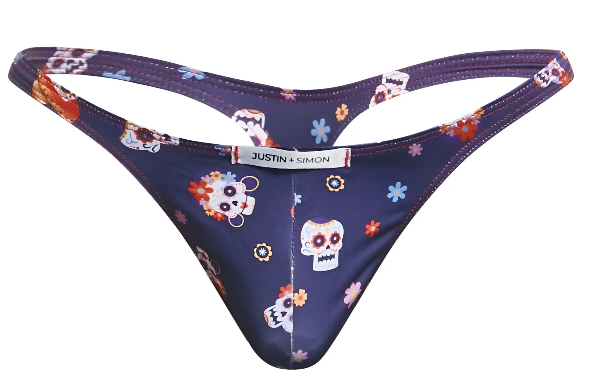 Dark blue thong with sugar skull and floral pattern featuring justin simon brand label in classic mexico design