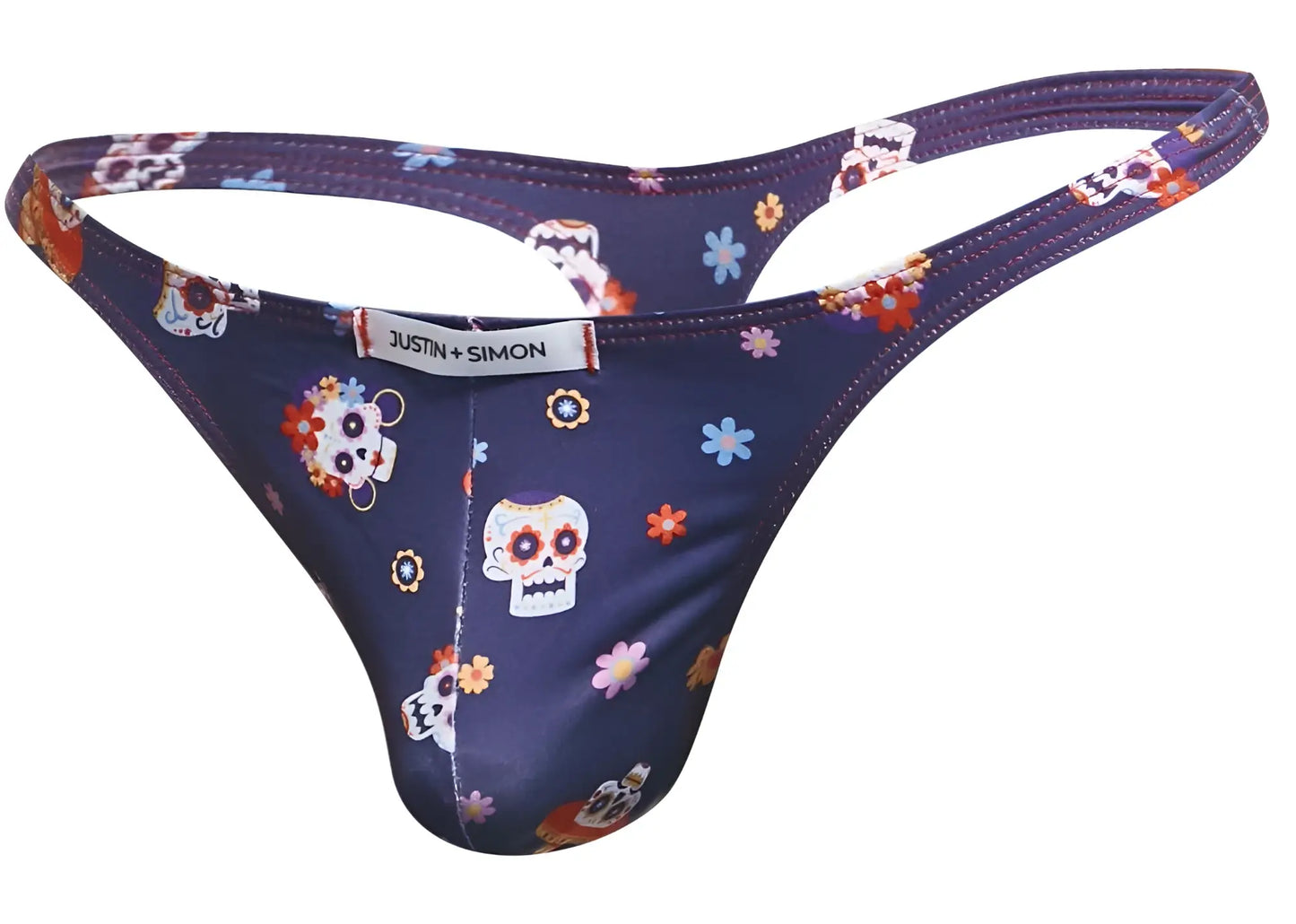 Dark blue classic thong with vibrant sugar skull and floral pattern and justin simon brand label visible on back side