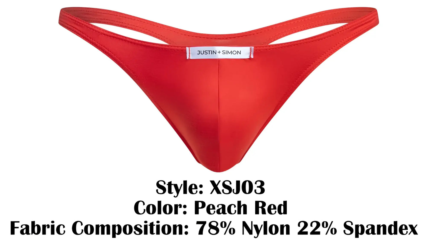 A vibrant peach red classic thong by justin + simon made from stretchy nylon spandex blend with center brand label
