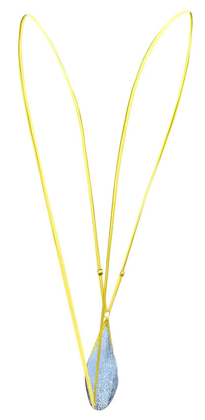 A delicate justin simon xsj04 sling color lurex blue gold-toned necklace with a shimmering blue glitter teardrop pendant
