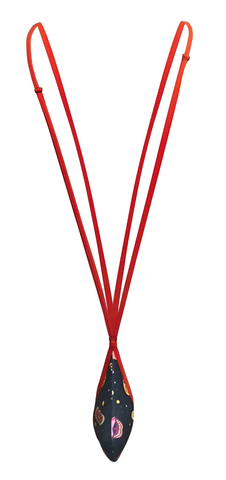 A vibrant red corded necklace with a teardrop navy fabric pendant featuring colorful paisley and star patterns by justin simon