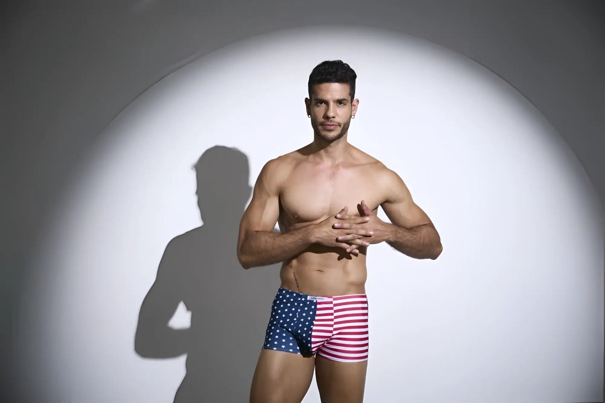 A man wearing justin simon xsj08 classic boxer briefs with american flag pattern in red white and blue colors