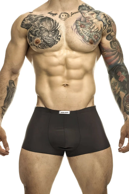 Black briefs with a white waistband label from justin simon classic trunks in gray color for everyday wear