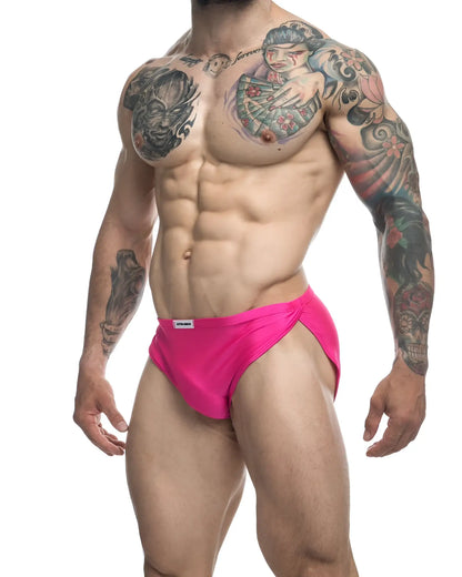 Bright pink justin simon xsj09 running shorts with snug fit and small white waistband label for athletic use