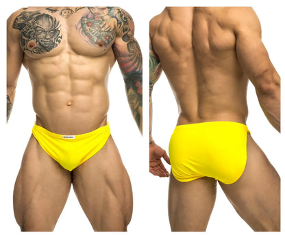 Bright yellow justin simon xsj09 running shorts with snug fit and white brand tag at waistband
