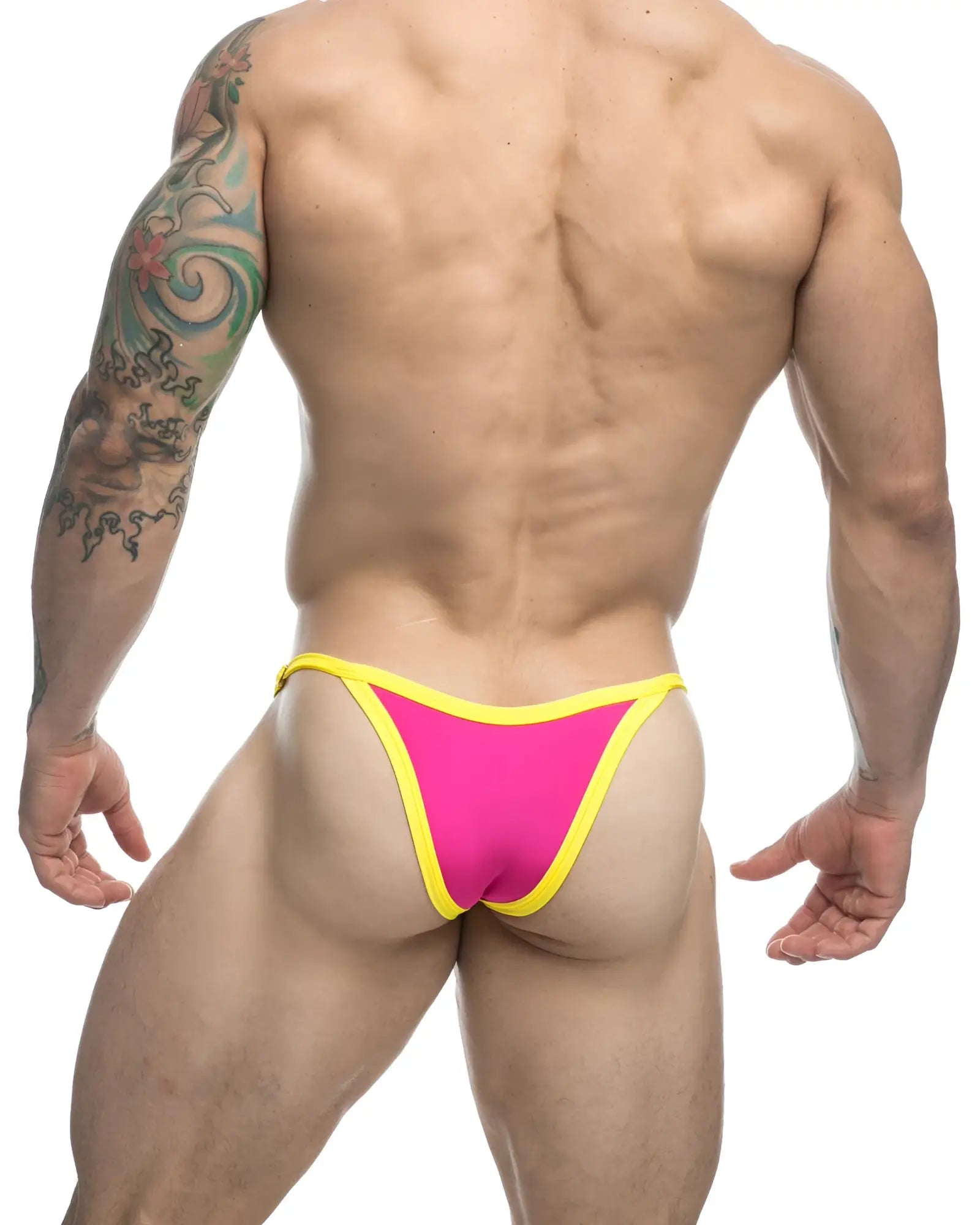 Bright pink and yellow JUSTIN SIMON XSJ12 bikini thong with a snug form-fitting design in one hot pink color