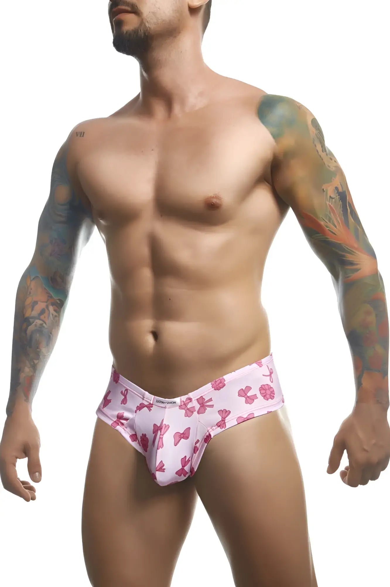 Justin plus Simon XSJ22 cheek briefs in coquette pink with bow pattern designed for men’s comfort and style