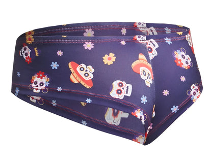 Dark blue justin simon xsj22 cheek briefs with vibrant day of the dead sugar skulls flowers and sombreros design