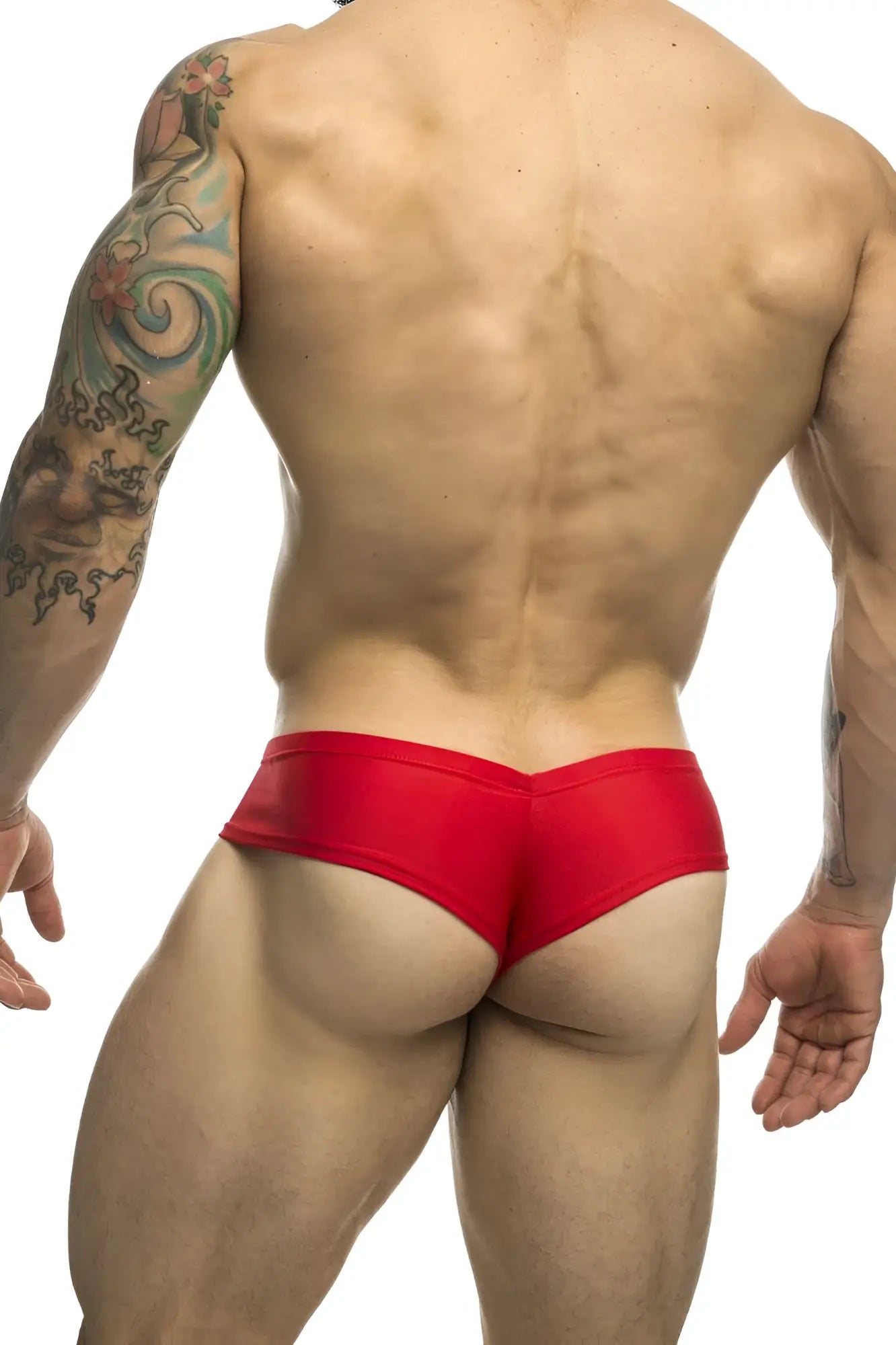 Red form-fitting swim trunks in smooth glossy fabric from JUSTIN+SIMON XSJ22 cheek briefs collection