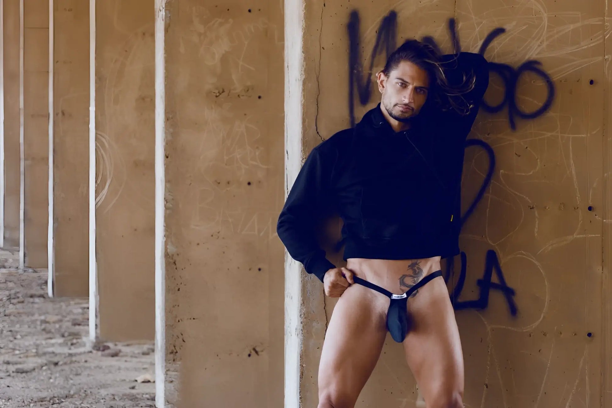Black leather Justin Simon bulge thong with a small silver buckle in opal green color front view