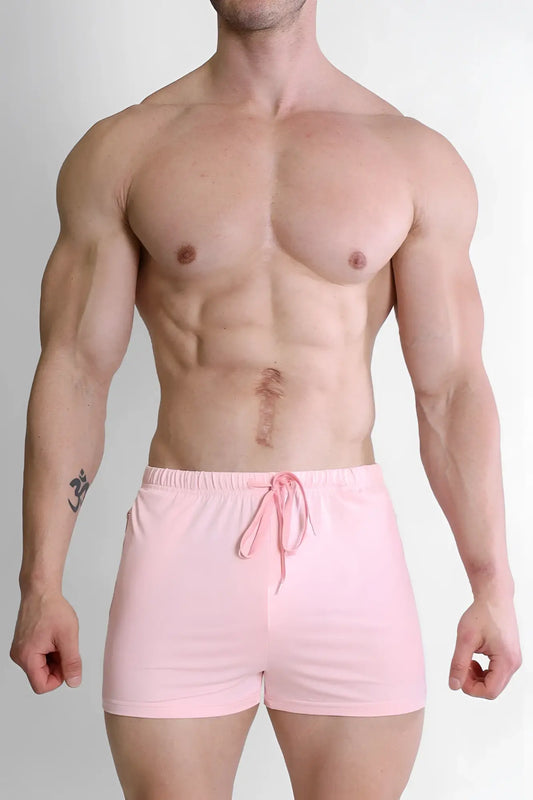 Pink karma 2 inch athletic shorts with zipper pockets and drawstring waistband for activewear use