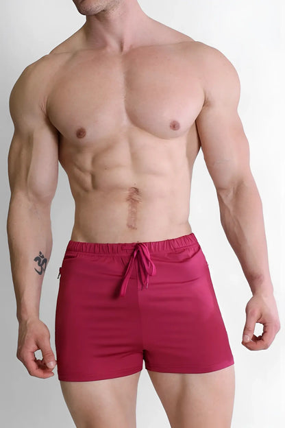 Bright red sleek fabric karma 2 inch short shorts with zipper pockets and drawstring waistband in magenta