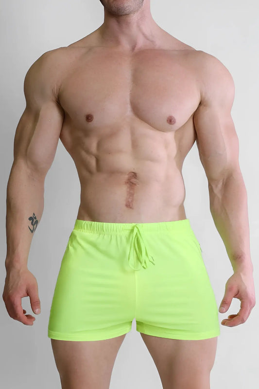 Karma 2 inch neon yellow athletic shorts with zipper pockets and drawstring waistband for active wear