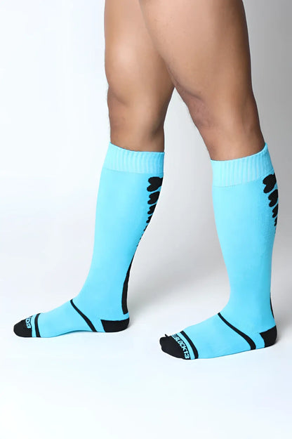 Light blue kennel club bones knee high socks with black accents ribbed cuff and skechers logo on the toe