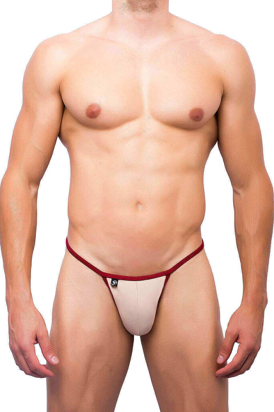 Beige and red joe snyder kini thong with a small black logo on the front in a sleek minimal design
