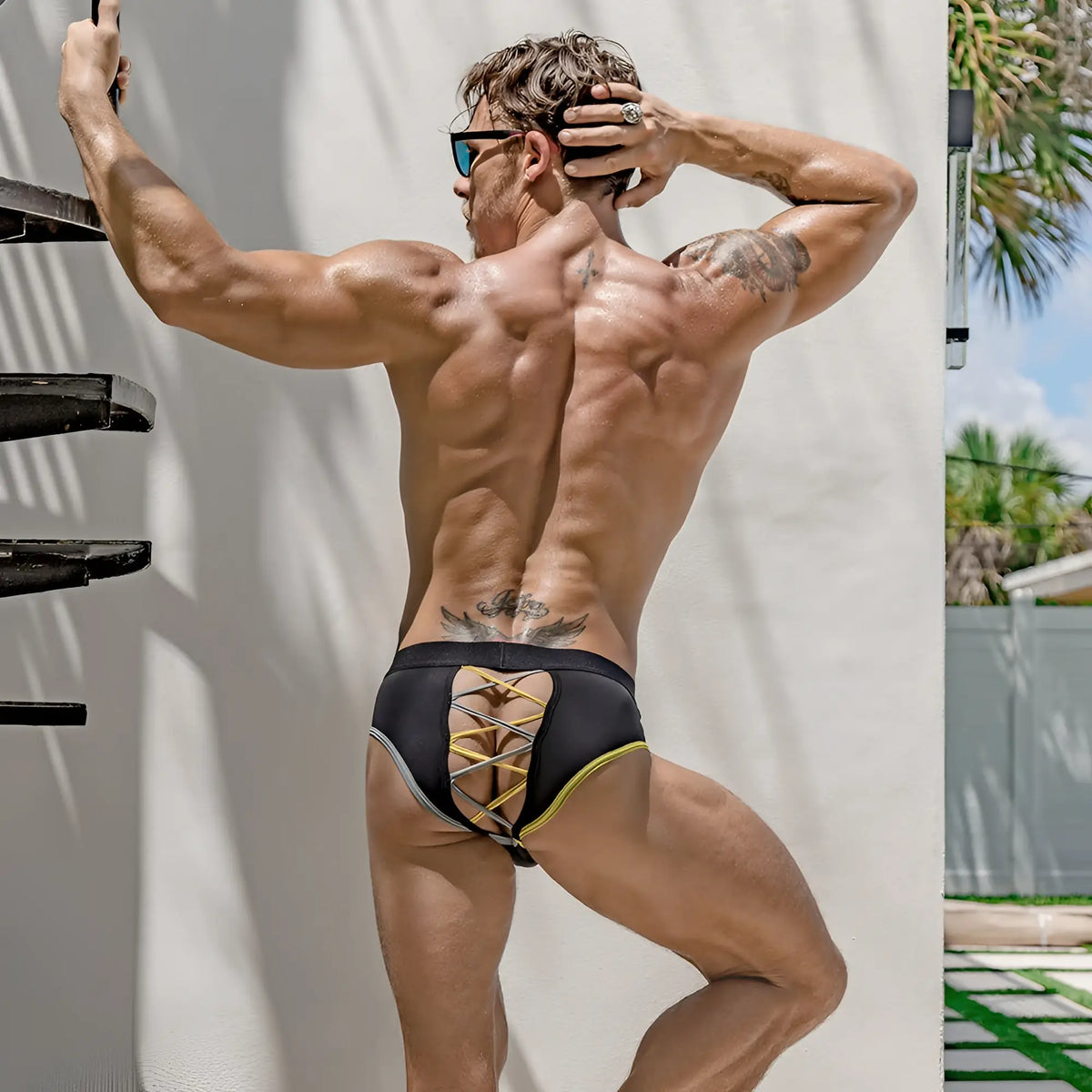 Kyle kli033 bikini brief black swim trunks with yellow lacing and gray trim front view for swimming and beachwear