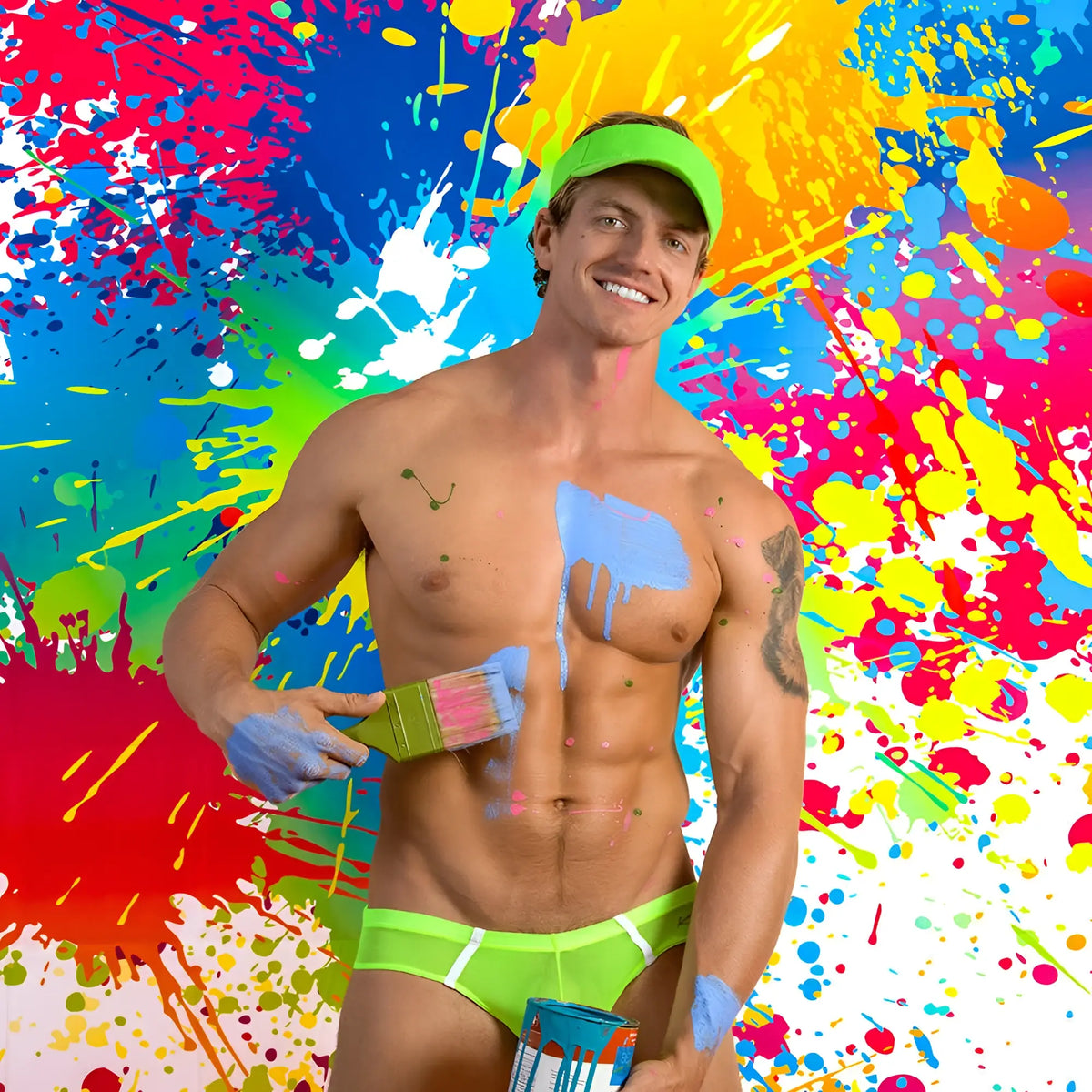 A muscular man wearing neon green kyle kli045 bikini brief swim trunks with matching visor covered in colorful paint