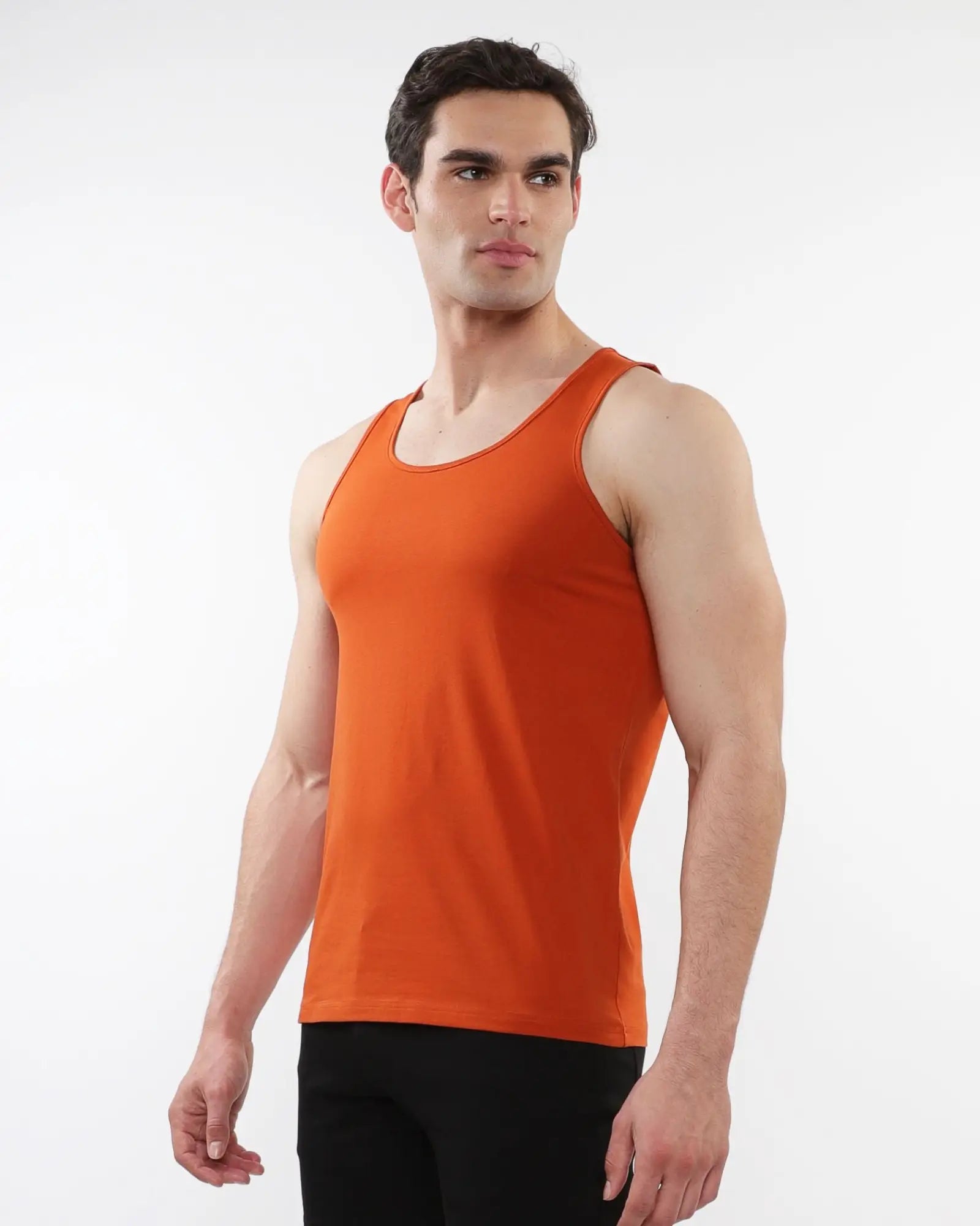 Orange sleeveless tank top made of laser cut stretch jersey for comfortable activewear use