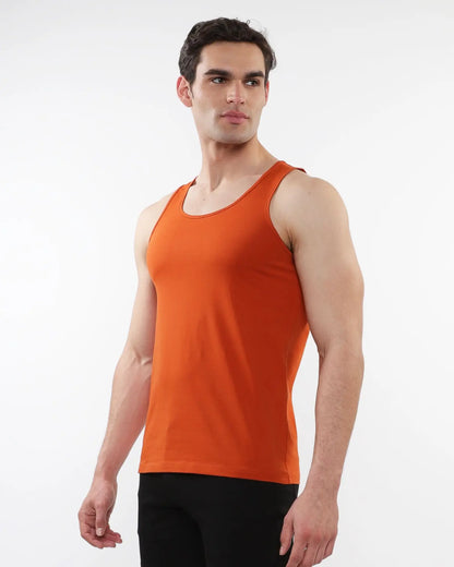 Orange sleeveless tank top made of laser cut stretch jersey for comfortable activewear use