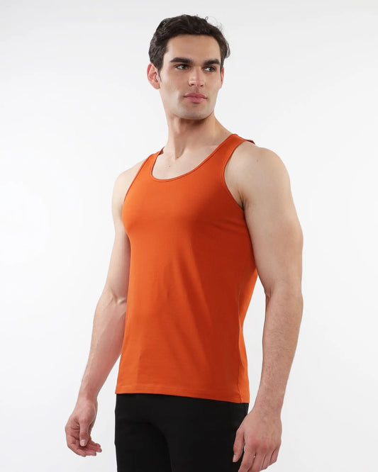 Orange sleeveless tank top made of laser cut stretch jersey for comfortable activewear use