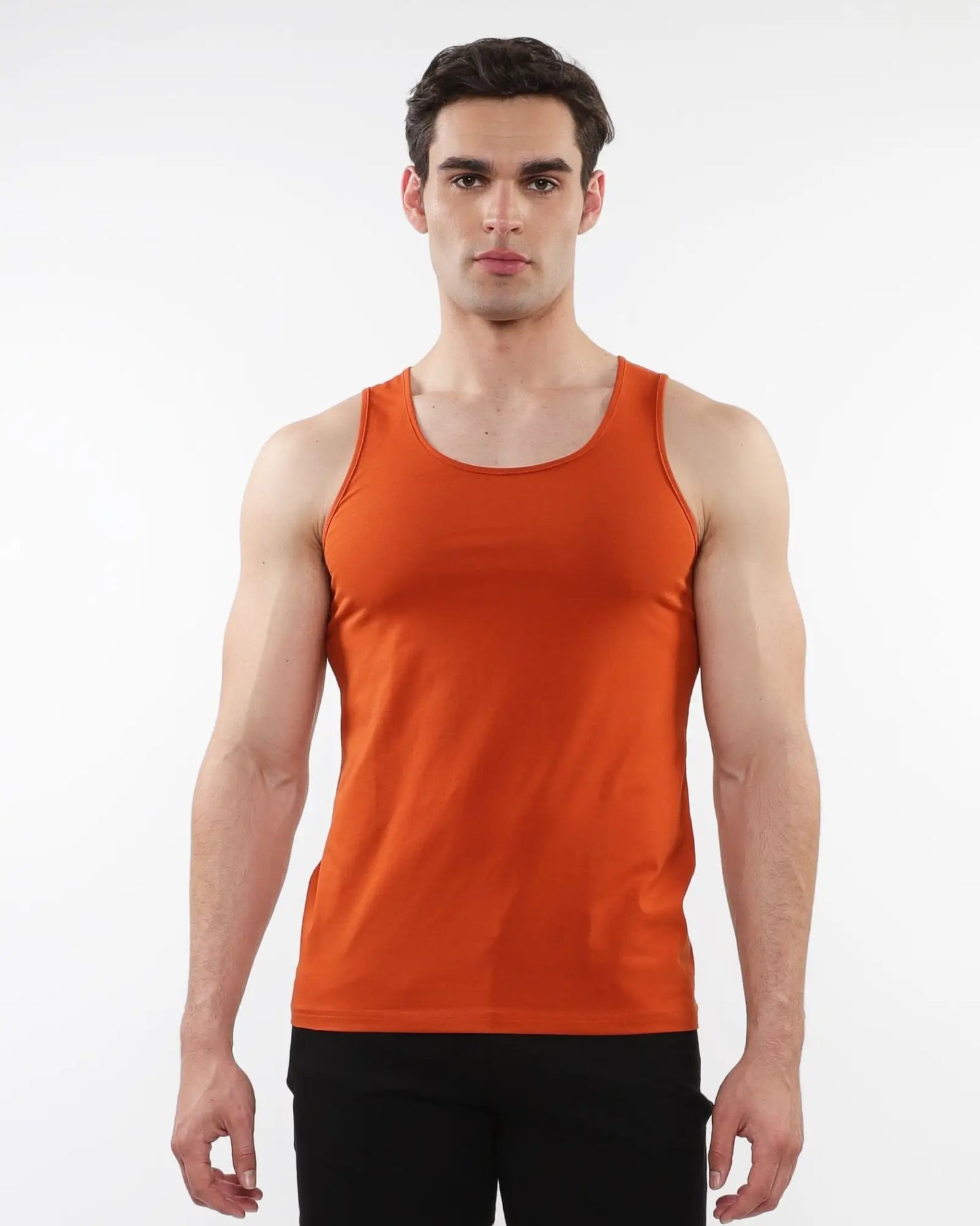 Orange sleeveless laser cut stretch jersey tank top designed for athletic performance and comfort