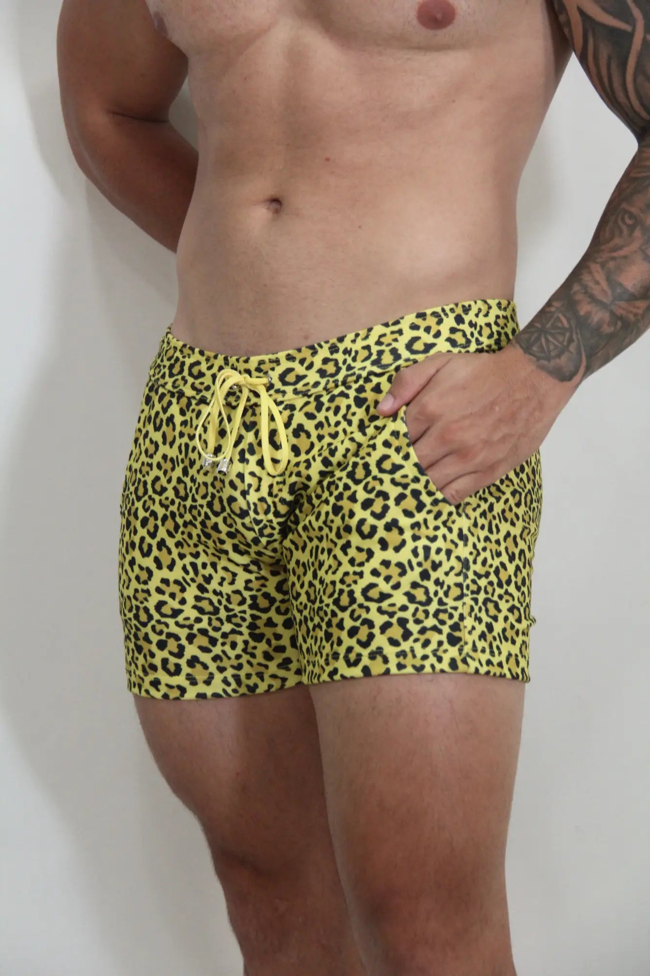 Bright yellow leopard fleece short swim trunks with matching drawstring waistband in soft fleece material
