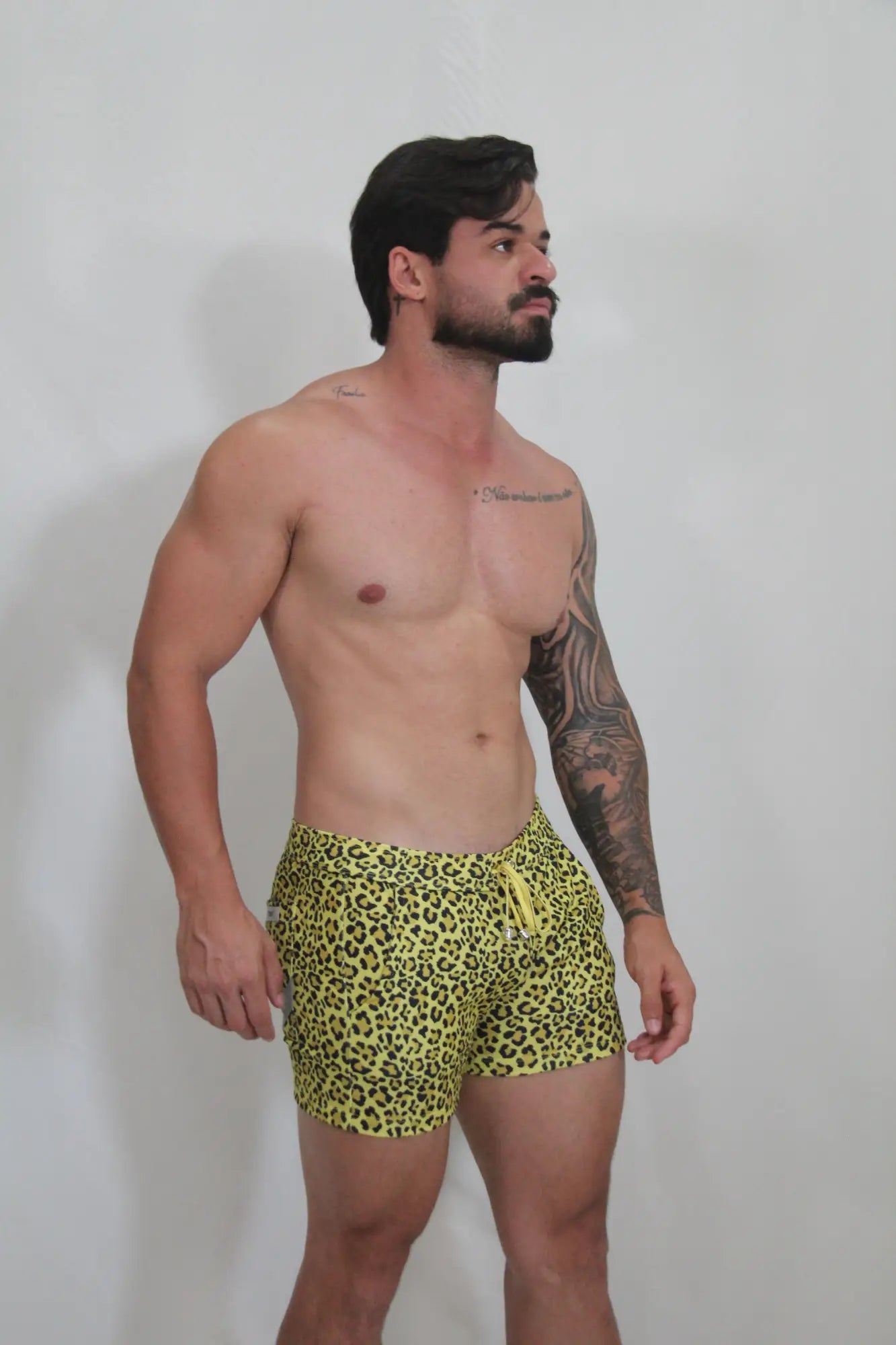 Bright yellow leopard fleece short swim trunks with drawstring waistband for comfortable beachwear