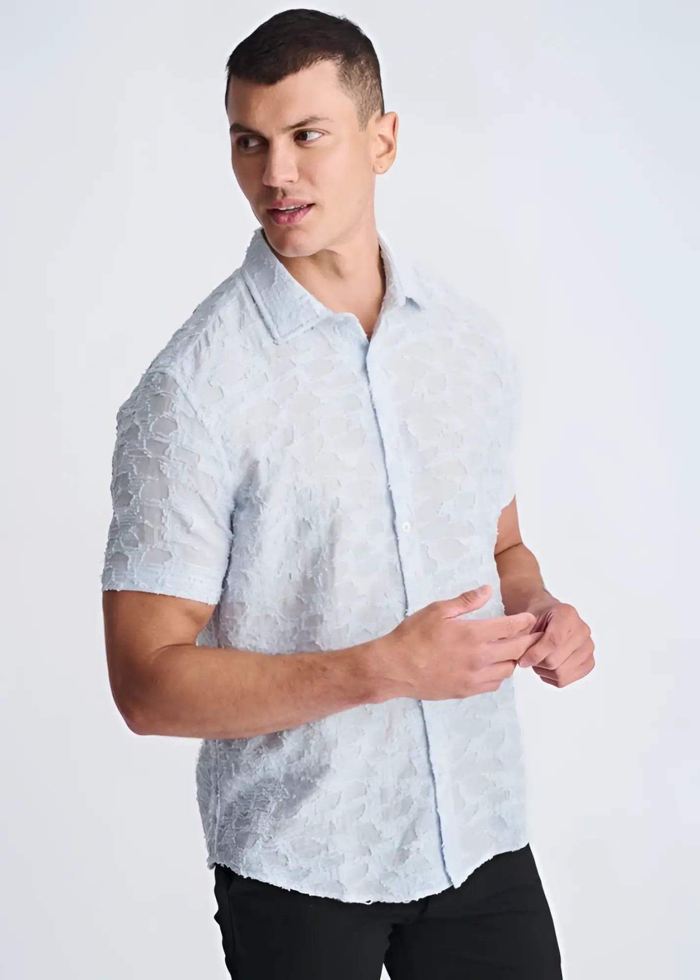 Light blue lightweight jacquard short-sleeved button-up shirt with a subtle textured pattern for warm weather wear
