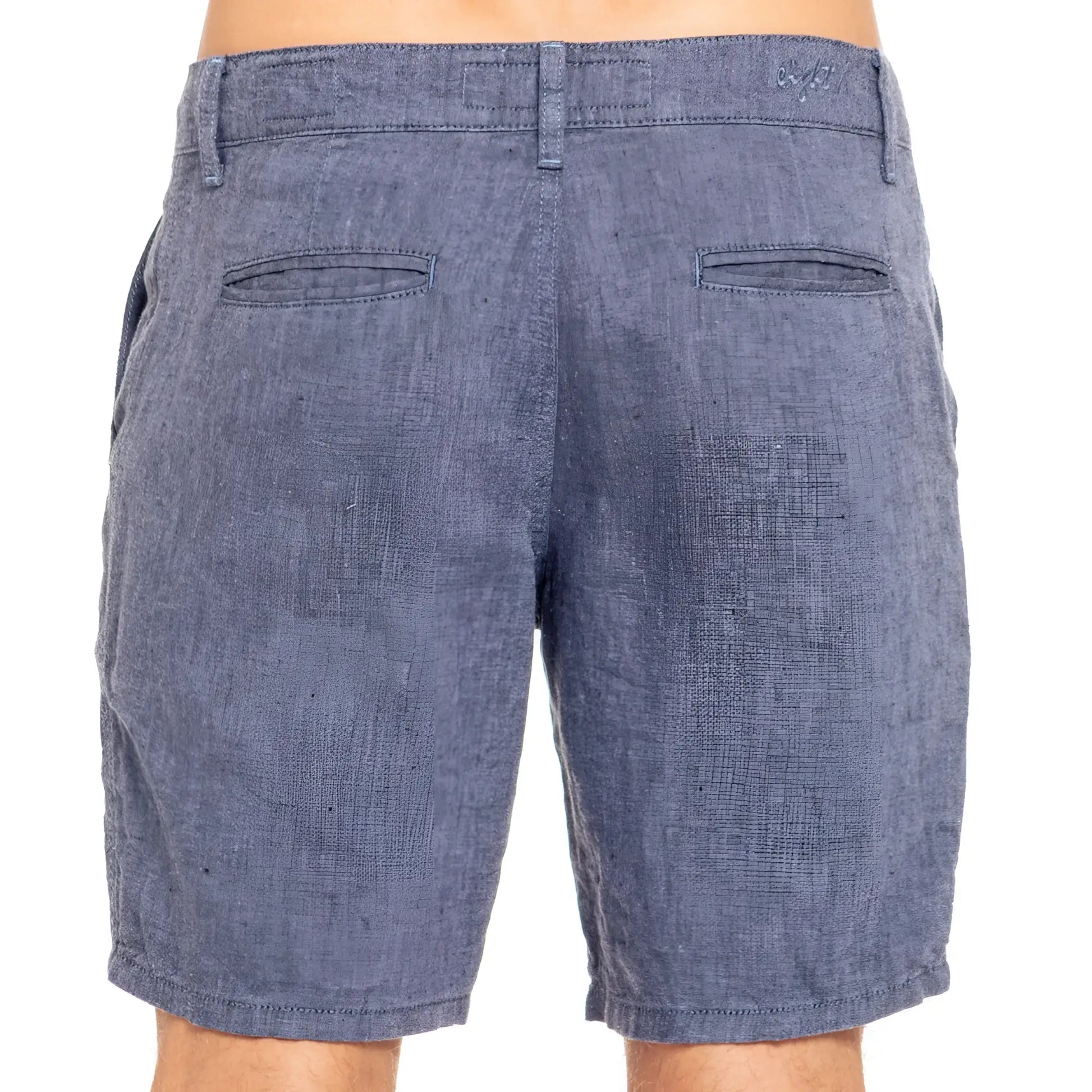 Blue linen slim fit shorts in denim with textured weave and two back pockets shown from the back side