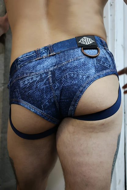 Blue denim patterned briefs with a black logo patch and copper metal ring at the waistband loaded denim brief