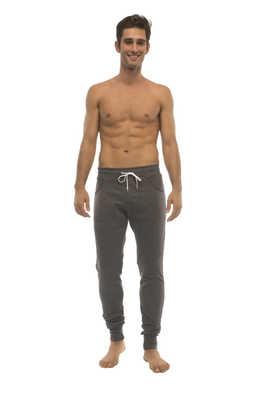 Dark gray long cuffed jogger and yoga sweat pants with white drawstring waistband and elastic cuffs for comfort